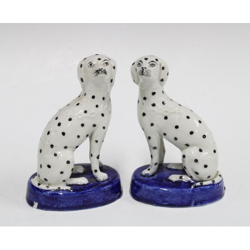 80 - Small pair of 19th century Staffordshire Dalmatians on oval blue bases, 12cm (2)