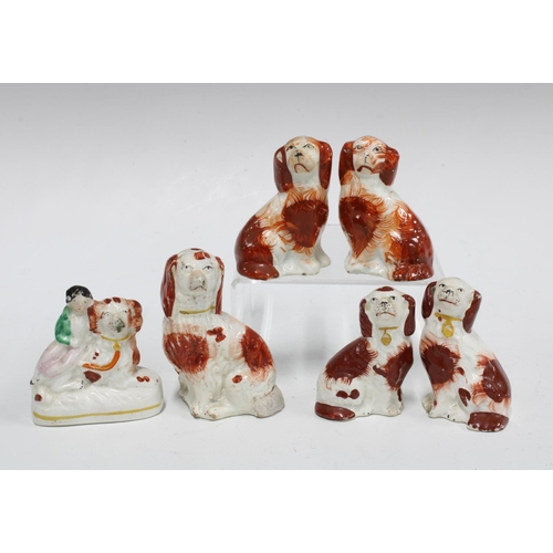 81 - A group of small 19th century Staffordshire spaniels, tallest 9cm (6)