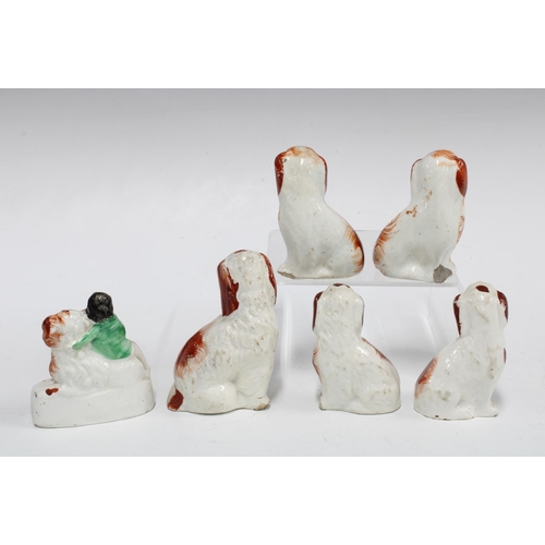 81 - A group of small 19th century Staffordshire spaniels, tallest 9cm (6)