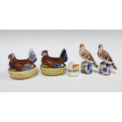 89 - Two small Staffordshire hen on nests, a swan and two birds, (4) (a/f) tallest 10cm