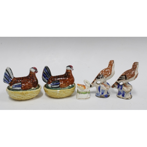 89 - Two small Staffordshire hen on nests, a swan and two birds, (4) (a/f) tallest 10cm