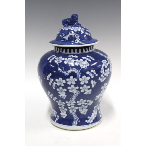 94 - Chinese blue and white prunus jar and cover, 26cm