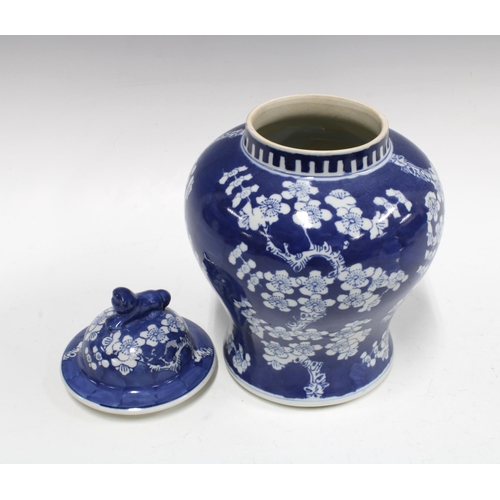 94 - Chinese blue and white prunus jar and cover, 26cm