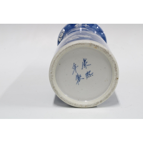 95 - Chinese blue and white sleeve vase with a figural panel against a prunus ground, 30cm