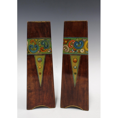 96 - A pair of Art Nouveau wooden vases, triangular form and painted with a band of stylised flowers, 31c... 