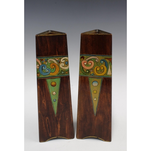 96 - A pair of Art Nouveau wooden vases, triangular form and painted with a band of stylised flowers, 31c... 