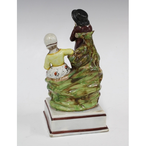 102 - Staffordshire Rural Pastimes pearlware  figure group, 9 x 18cm.