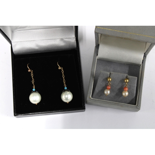 32 - A pair of pearl drop earrings and a pair of pearl and coral drop earrings (2)