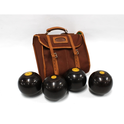 372 - Set of four Lignum Vitae bowls, in a bowling bag