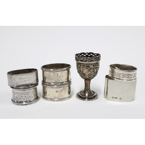42 - Victorian silver egg cup, London 1895 and a collection of six silver napkin rings with various hallm... 