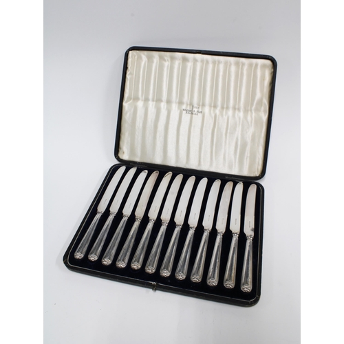 99F - Cased set of twelve silver handled fruit knives by Walker & Hall, (12)