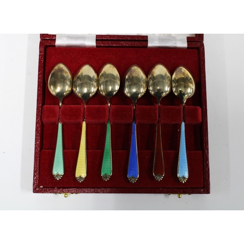 99J - A harlequin cased set of six silver gilt and enamel coffee spoons, Birmingham 1958 (6)