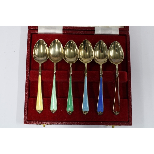 99J - A harlequin cased set of six silver gilt and enamel coffee spoons, Birmingham 1958 (6)