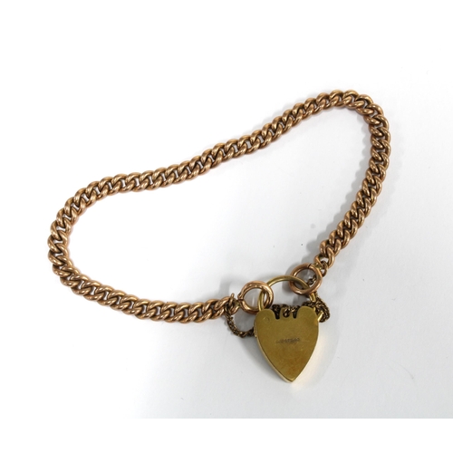 82 - 9ct gold curb link bracelet with a 9ct gold heart shaped padlock