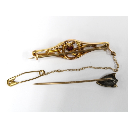 87 - 9ct gold brooch and a shield tiepin (2)