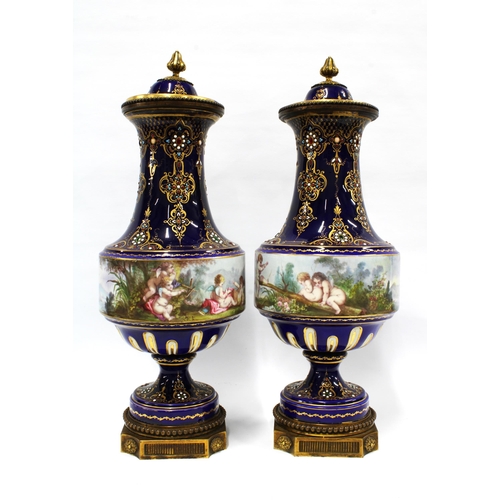 397 - A pair of French lidded vases, with jewelled decoration and cobalt blue ground, with a handpainted b... 