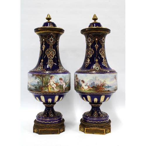 397 - A pair of French lidded vases, with jewelled decoration and cobalt blue ground, with a handpainted b... 