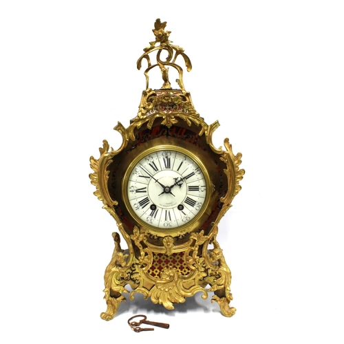 398 - A 'Boulle' mantle clock with French brass movement, retailed by Howell & James, London, 53cm high