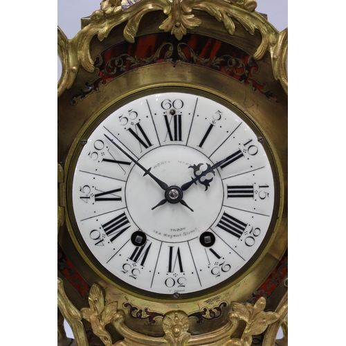 398 - A 'Boulle' mantle clock with French brass movement, retailed by Howell & James, London, 53cm high