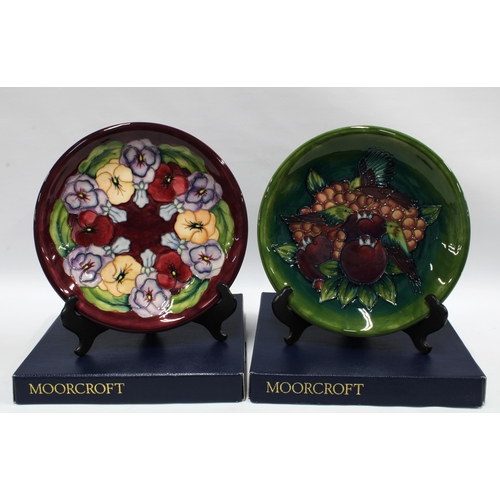 422 - Two Moorcroft Pottery boxed plates to include Pansy and Pomegranates and Finches plate (2)