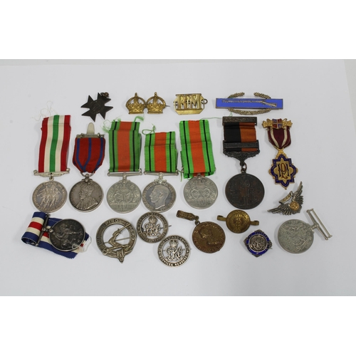 429 - Quantity of WWI & WWII medals, military cap and lapel badges, some silver hallmarked and commemorati... 