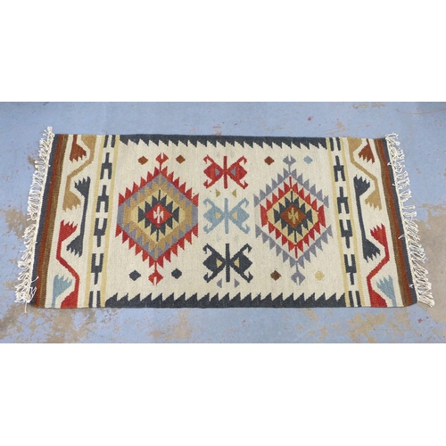 441 - A flatweave Kelim type rug with geometric motifs, 60 x 130cm approx