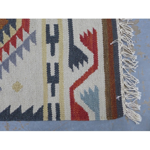 441 - A flatweave Kelim type rug with geometric motifs, 60 x 130cm approx