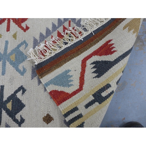 441 - A flatweave Kelim type rug with geometric motifs, 60 x 130cm approx