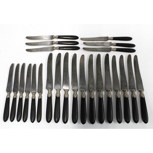 100C - French Empire knives, c1850 with ebonised handles and white metal mounts and steel blades, inscribed... 