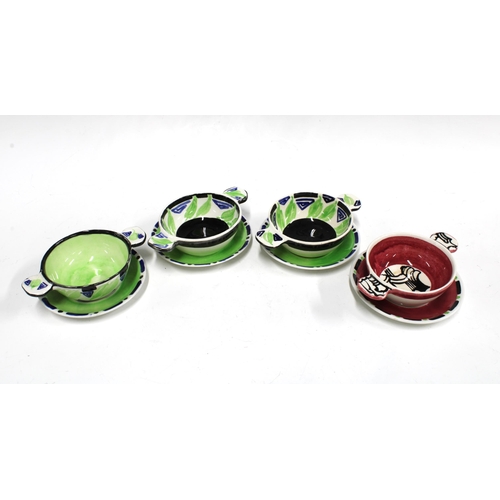 116 - A set of three Bough Scottish Pottery quaich complete with stands, painted in black, green and blue ... 