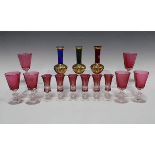 118 - Set of six cranberry glass wine glasses with knop stems and a set of six smaller glasses and three B... 