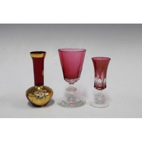 118 - Set of six cranberry glass wine glasses with knop stems and a set of six smaller glasses and three B... 