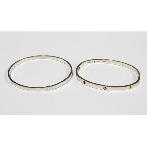 12 - Seven contemporary silver bangles to include one  inscribed Tiffany & Co, together with a silver dre... 