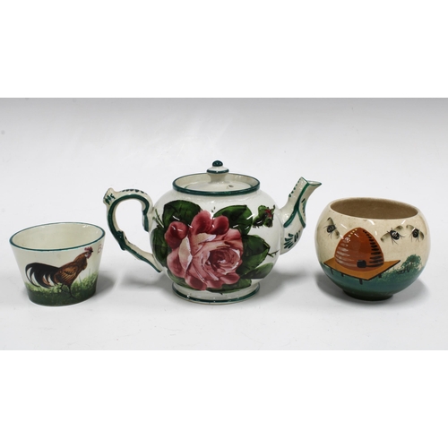 126 - Wemyss pottery miniature teapot painted with cabbage roses and a cockerel 'Bon Jour' bowl, both reta... 