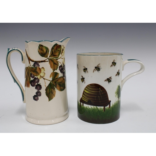 130 - Griselda Hill Pottery bees & skep hive jug and a Griselda Hill blackberries pattern jug (2) 18 x 21c... 