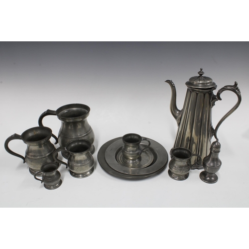 154 - Collection of antique pewter wares to include a coffee pot, tankards, measures, plates and pepper po... 