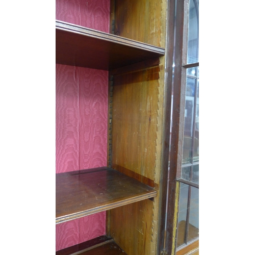 201 - Mahogany breakfront bookcase cabinet with four glazed doors over four panelled doors, plinth base,  ... 