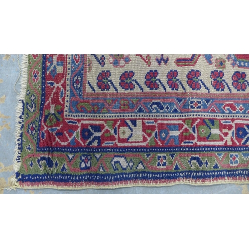 210 - Caucasian rug with a central lozenge and flowers, with multiple borders, 140 x 104cm