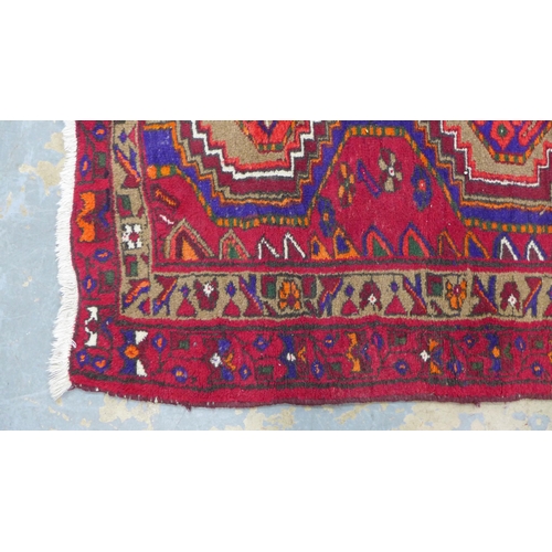 211 - Hamadan Zaronim rug, red field and triple pole medallion,  143 x 100cm