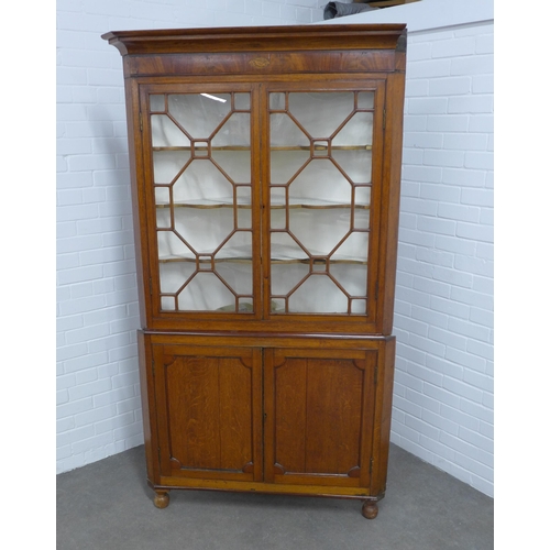 216 - 19th century floor standing  oak corner cupboard,  glazed top with paterae, painted internal shelves... 