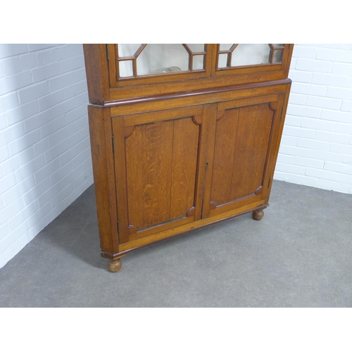 216 - 19th century floor standing  oak corner cupboard,  glazed top with paterae, painted internal shelves... 