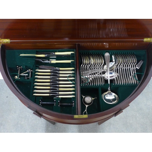 221 - Mahogany D-end fold over cutlery table table opening to reveal a suite of  EPNS flatware, with four ... 