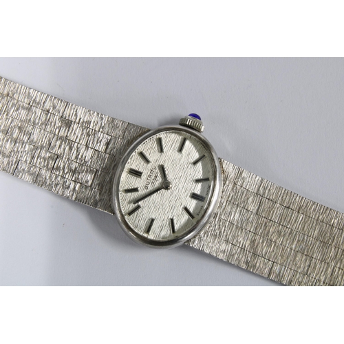 25 - ROTARY, ladies vintage silver wristwatch on a textured silver bracelet strap, blue cabochon winding ... 