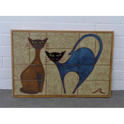 308 - 20th century tiled panel depicting two cats, signed with initial 'R', framed, 62 x 42cm.