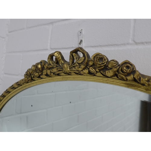 314 - Gilt framed oval wall mirror, 73 x 49cm.