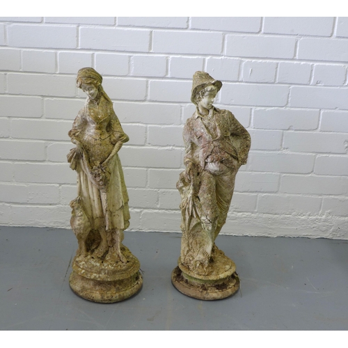 321 - Companion male and female garden statues, 25 x 62cm. (2)