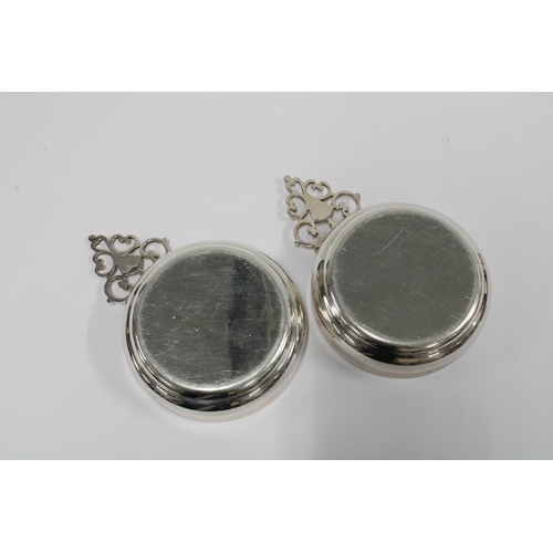 34 - A pair of  George VI silver wine tasters, each with a circular bowl and pierced handle, Sheffield 19... 