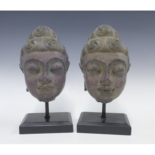 399 - Pair of contemporary Thai style buddha heads on stands, 34cm (2)