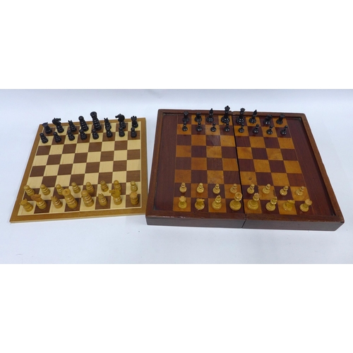 411 - Two chess sets with folding chess boards, one with backgammon markings on the reverse, 48 x 38cm ope... 