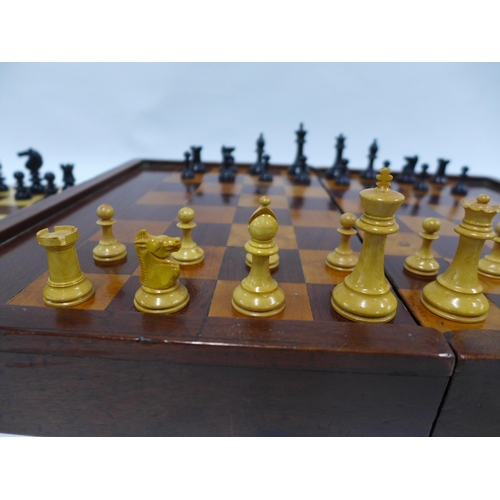 411 - Two chess sets with folding chess boards, one with backgammon markings on the reverse, 48 x 38cm ope... 